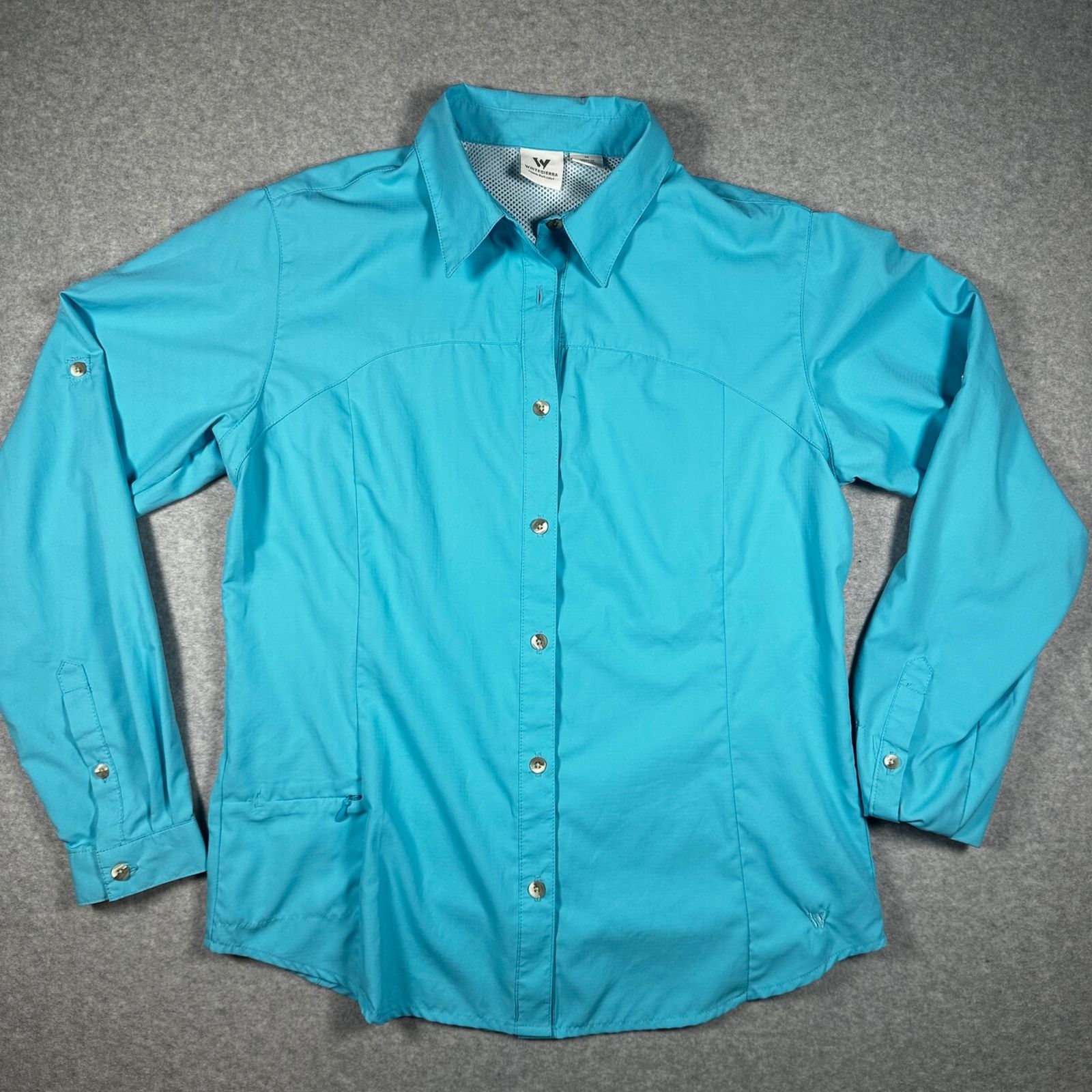 Turquoise button-front shirt laid flat, showing curved chest seams and a gently shaped waist.