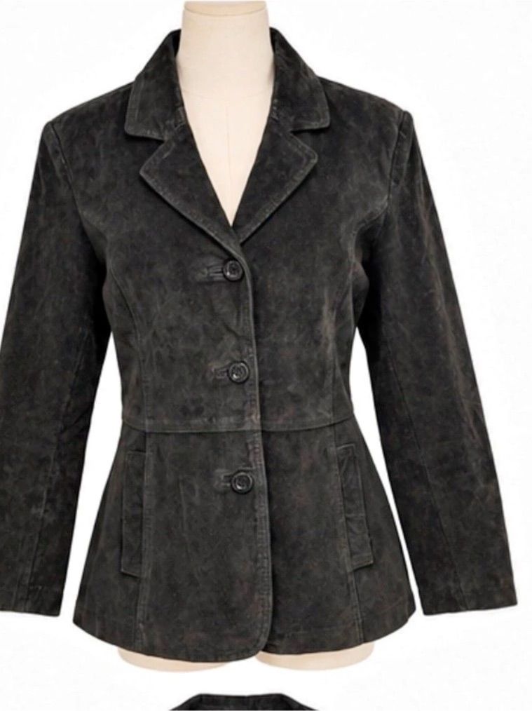 Black suede blazer on a mannequin, with a narrowed waist and gently flared hem.