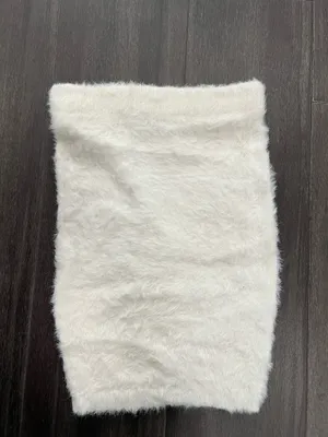 Fuzzy knit skirt in a soft white tone. Plush, textured fabric. Stretchy fit for comfort. Easy to style for layered looks or solo wear. Size small. hot & delicious thumbnail 3