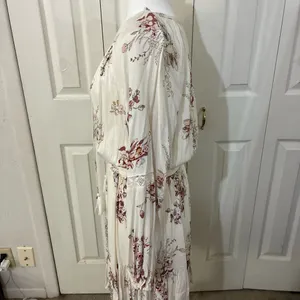 The American Rag Long Sleeve Lace Up Bodice Floral Dress in Cream is a stylish and versatile option for women. This fit & flare dress features a floral pattern in cream, pink, and white, making it perfect for various occasions such as travel, weddings, parties, or casual outings. The long sleeves and lace-up bodice add a touch of elegance, while the short dress length adds a trendy flair. Made from a blend of rayon, cotton, polyester, and linen, this dress offers both comfort and style for women in size M. thumbnail 3