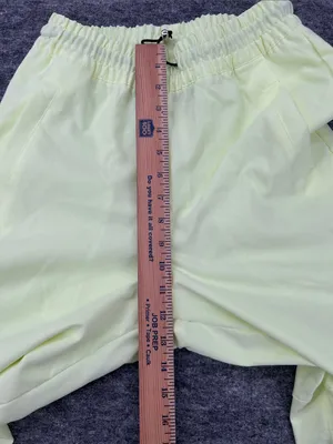 Nike Women's Sportswear Woven Pants in a bright neon green/yellow XS thumbnail 10