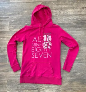 Y2K Pink Aeropostale hoodie with white text reading 'AEROPOSTALE 1987' size M Ptp: 18.5” Inseam: 21.5” Small imperfections as pictured on the front barely noticeable #aeropostale #y2k #hoodie #00s #aero thumbnail 1
