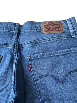 Levi’s medium-wash, high-waisted distressed straight-leg jeans thumbnail 9