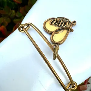 Alex and Ani love charm gold tone bangle bracelet thumbnail 9