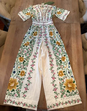 The Farm Rio Folk Floral Jumpsuit features a vibrant print with short sleeves, a V-neckline, and a relaxed, wide-leg silhouette. thumbnail 2