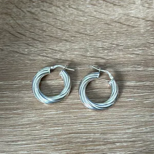 Twisted silver mini hoop thumbnail 2