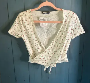 Brandy Melville Women’s Floral Wrap Crop Top - White with Red Floral Print | New thumbnail 1