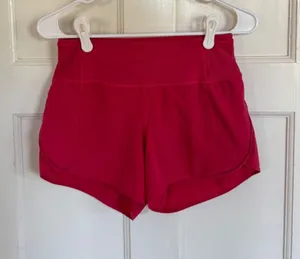 Lululemon bright pink running shorts Size 4 thumbnail 1