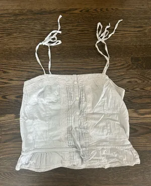 Baby blue Brandy Melville Maeve lace cami top with button-up front and ruffled hem thumbnail 1
