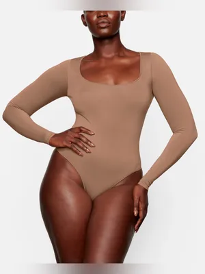 SKIMS Essential Long Sleeve Scoop Neck Bodysuit brown nude women one piece shapewear thumbnail 1