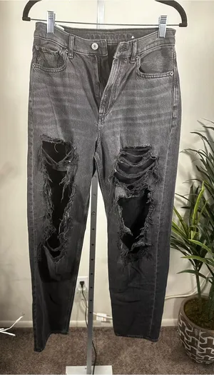 J135. American Eagle women’s distressed black/washed-gray jeans thumbnail 1