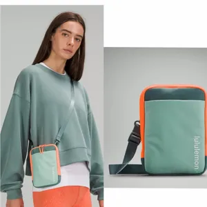 Lululemon easy access crossbody orange green bag travel casual bag thumbnail 2
