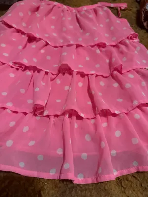 Lightweight pink tank with white polka dots. Features layered ruffle tiers and thin adjustable straps. Flows and feminine silhouette. Great for warm-weather styling. thumbnail 3