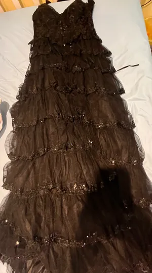 Dillard's off-the-shoulder, black, ruffle gown with sequin corset back thumbnail 2