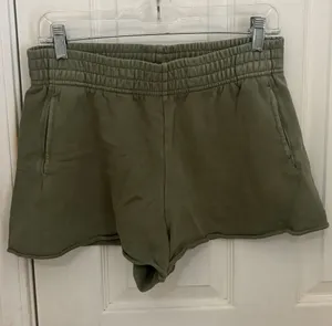 Offline by Aerie Pull-On Raw Hem Sweatshorts in Olive Green thumbnail 1