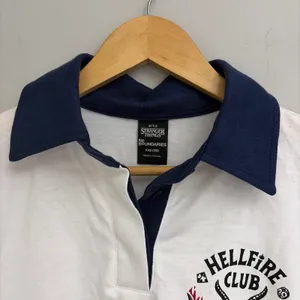 No Boundaries Stranger Things New! Hellfire Club Rugby Graphic Polo Size XXS thumbnail 2