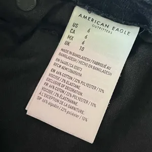 American Eagle • Distressed Washed Black Button Fly Super High Rise Shorties thumbnail 6