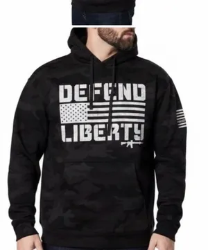 Howitzer "Defend Liberty" Black Camo Hoodie Elevate your casual wear with this rugged and patriotic Howitzer "Defend Liberty" Hoodie. Featuring a stealthy black multicam (camo) pattern, this hoodie is designed for those who value both style and a strong message of freedom. Constructed with high-quality, durable fabric, it offers a comfortable fit perfect for outdoor adventures, range days, or daily wear. Product Features: • Brand: Howitzer Manufacturing Co. • Design: Bold "DEFEND LIBERTY" distressed graphic with the American flag and an AR-15 silhouette on the front. • Back Detail: A vertical "DEFEND LIBERTY" spine graphic for a unique look from every angle. • Sleeve Detail: Features the Howitzer brand American flag patch on the sleeve. • Pattern: Modern black/dark grey camouflage. • Style: Pullover with adjustable drawstring hood and a spacious kangaroo front pocket. thumbnail 1