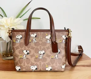 NWT Coach X Peanuts City‎ Mini Tote Bag In Signature Canvas with snoopy print thumbnail 1