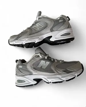 New Balance Woman's Grey and White Athletic Sneakers thumbnail 4