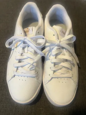 Puma Women's White Low-Top Leather Sneakers with Subtle Gold Logo thumbnail 1