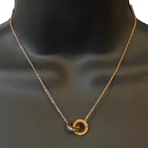 18K gold plated eternity interlocking Roman numeral necklace thumbnail 1