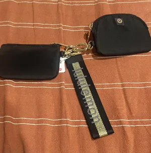 Lululemon Dual Wristlet NWT Black & Gold thumbnail 1