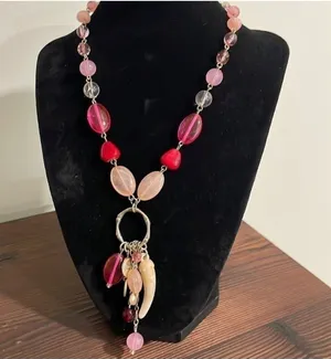 Pink beaded charm necklace with stone horn of wealth and silver tone accents thumbnail 1