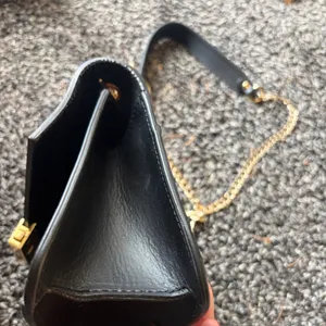 Elegant Black Leather Bag with Gold Accents thumbnail 9