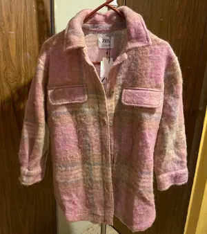ZARA pink plaid wool-blend shacket with soft brushed texture. Lightweight outer layer styled with front flap pockets and a relaxed collar. Versatile layering piece that adds a feminine pop of pink to outfits. thumbnail 1