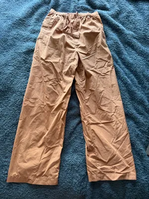Orange wide leg Uniqlo pants thumbnail 1
