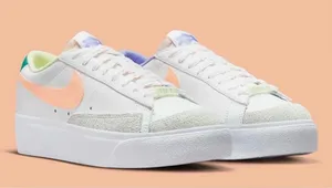 Nike Women’s White Sneakers with Peach Swoosh and Lavender Detail thumbnail 1