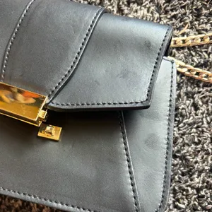 Elegant Black Leather Bag with Gold Accents thumbnail 2