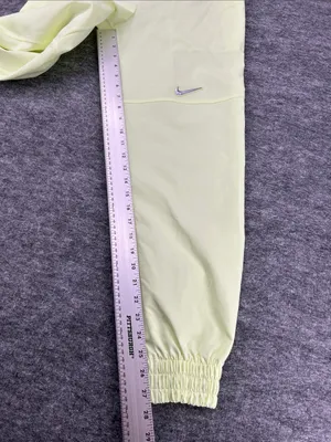 Nike Women's Sportswear Woven Pants in a bright neon green/yellow XS thumbnail 11