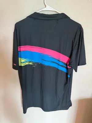 Chubbies Men's Performance Polo Shirt Size Small - Excellent Like New Description Upgrade your weekend wardrobe with this men’s Chubbies performance polo shirt in an excellent, like new condition (Size Small). Featuring a sleek black base with a vibrant pink, blue, and neon yellow brushstroke graphic wrap-around design, this shirt delivers the ultimate casual vibe. Made from a premium, ultra-comfortable 88% polyester and 12% spandex blend, it offers the perfect stretch for golf, resort wear, or casual outings. Lightly worn with no visible flaws—looks exactly as pictured. Fast shipping! thumbnail 3