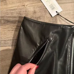 We Wore What Black Vegan Leather Mini Skirt with Silver Zipper thumbnail 5