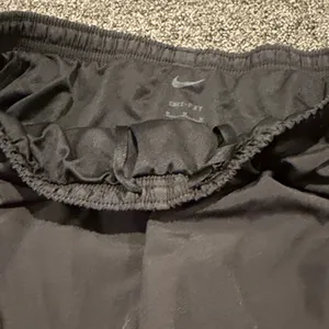 Nike Women's Athletic Shorts in Black and Red thumbnail 5