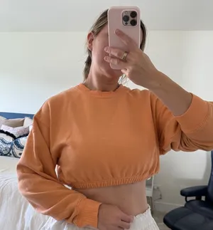 Discolored alo yoga orange crop crew neck sweatshirt size medium thumbnail 1