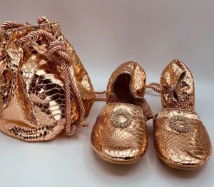 Joan Boyce ballet flats and drawstring bucket bag in rose gold faux leather thumbnail 1