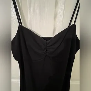 Black dress with ruffles at the bottom. thumbnail 3