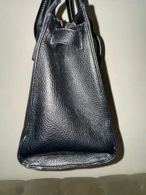 Women’s black handle bag with metal design in the front thumbnail 3