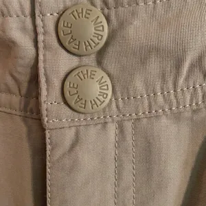 The North Face women's. Convertible Pants Beige Cargo Shorts Hiking Outdoor thumbnail 4