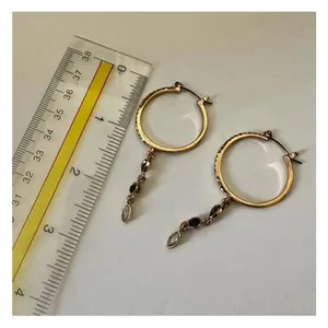 Gold tone hoop earrings with dangling rhinestones thumbnail 4
