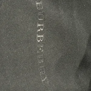 Burberry Black Case with Gold Logo includes Burberry cleaning cloth. thumbnail 3