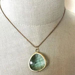 Gold tone and green pendant necklace thumbnail 1