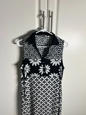 Chic sleeveless black and white dress with bold floral and geometric patterns. Lightweight and breathable for comfortable all-day wear. Collared neckline adds a polished touch and pockets. Easy to style for casual or dressy occasions. BIBA size medium thumbnail 2