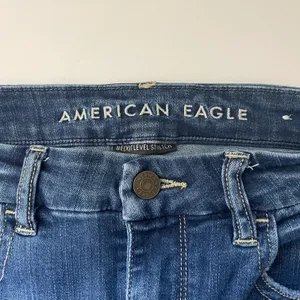 American Eagle Dark Wash Super High Rise Ripped Curvy Skinny Jeans thumbnail 10