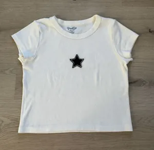 Brandy Melville White Tee with Black Star Patch thumbnail 1