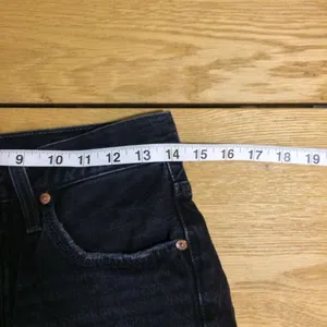 Levi’s 501 raw hem black buttonfly shorts 27 thumbnail 2