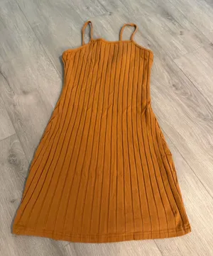 SHEIN Ribbed Cami Mini Dress – Size Small – Like New This camel brown ribbed cami mini dress from SHEIN is in excellent, like-new condition with no visible marks, stains, or flaws. Brand: SHEIN Size: Women's Small (US 4 / EU 36) Condition: Like New / Flawless Features: Vertical ribbed knit texture, cami spaghetti straps, stretch fit, casual mini length Comfortable and versatile, it pairs perfectly with sandals, sneakers, or layered under a jacket or cardigan. Ships fast from a clean, smoke-free home! thumbnail 1